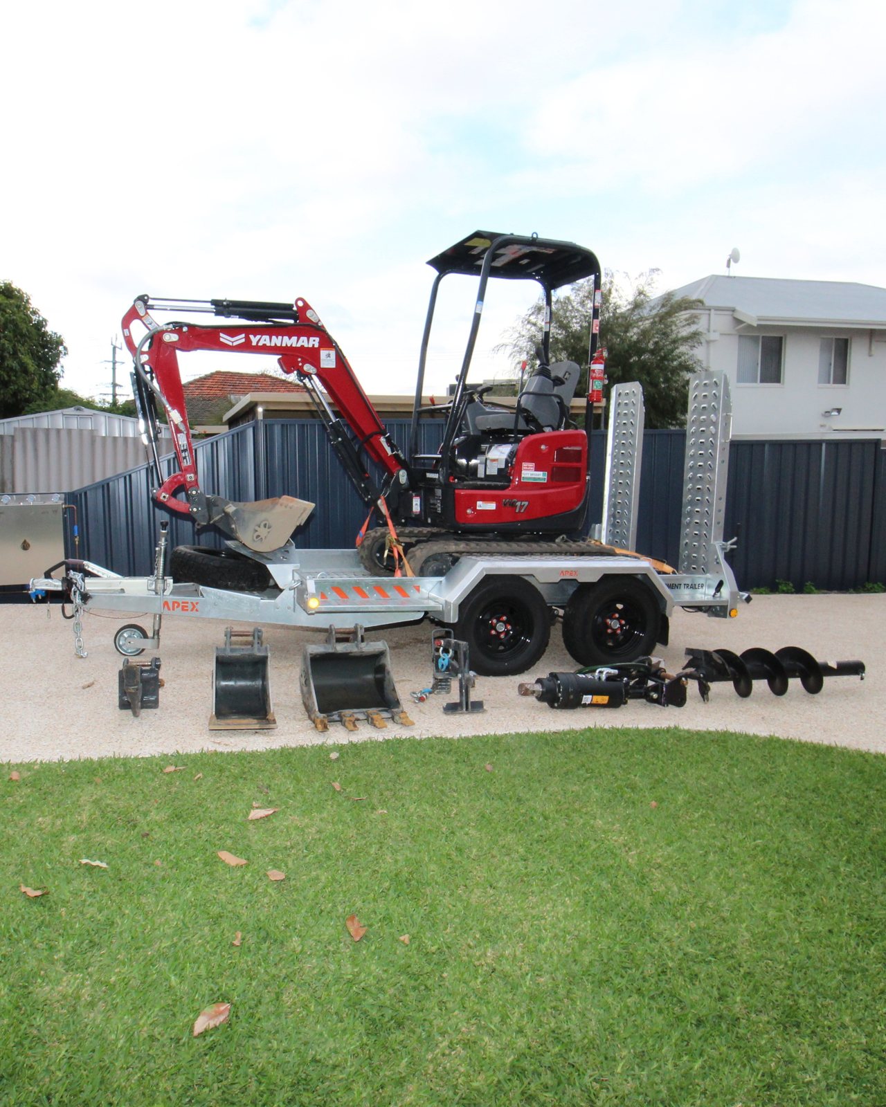 TNI Yanmar ViO17-1 mini excavator strapped down on an Apex plant trailer with buckets, auger drive and auger bits laid out in front