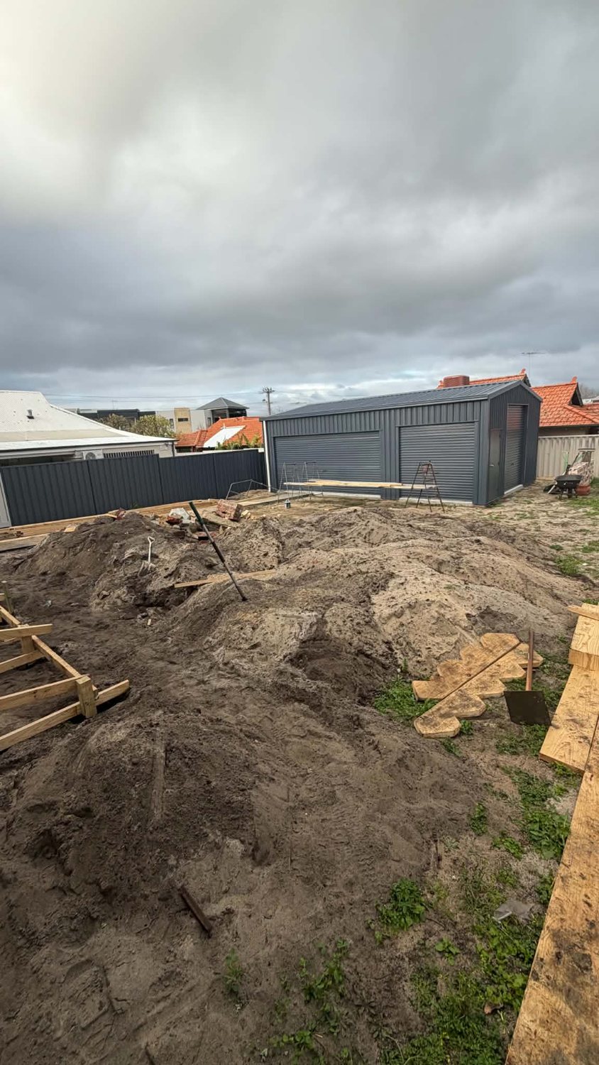 Site before works โ sand and rubble cleared for the new deck area