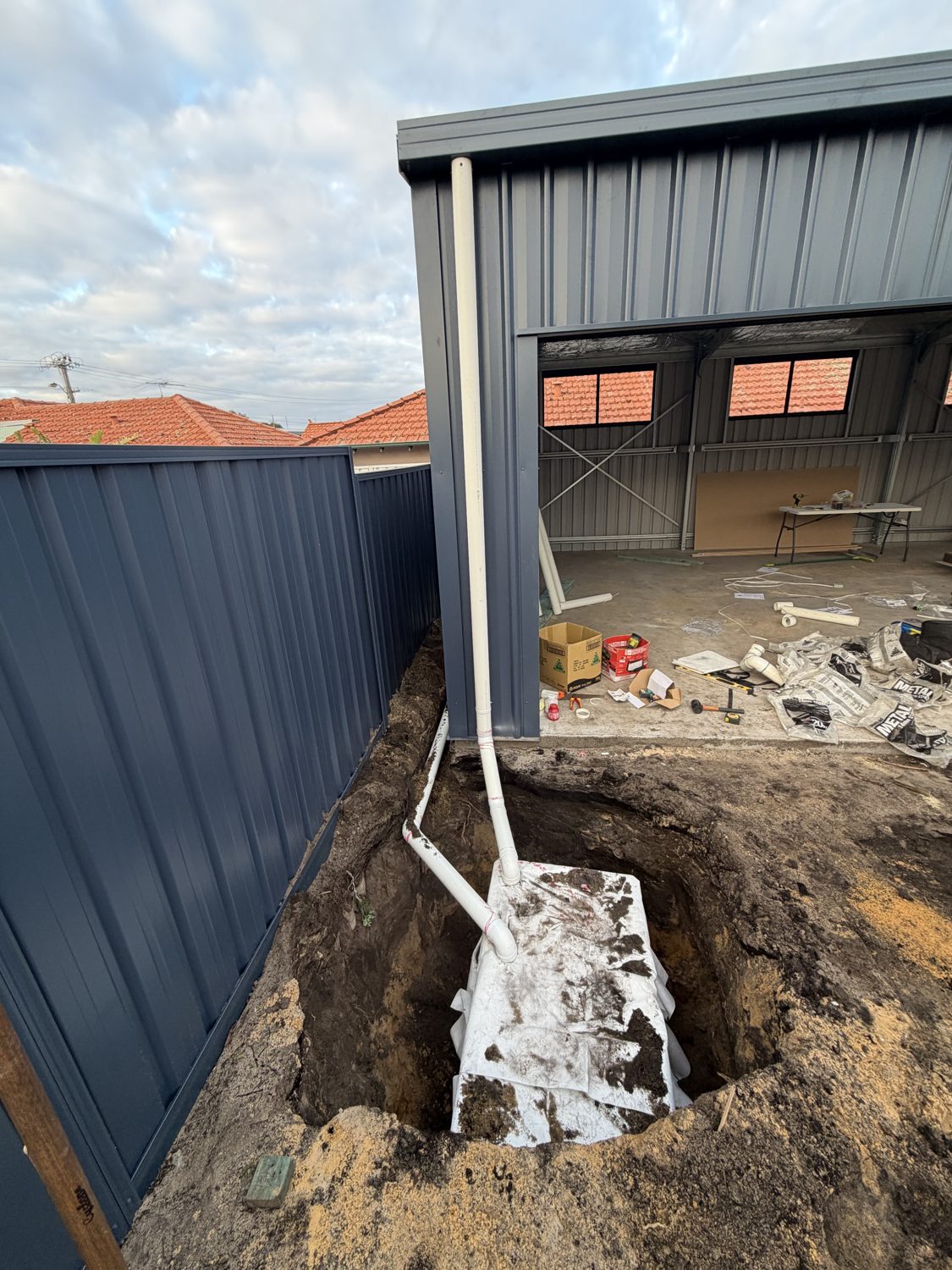Soakwell set in the hole with the stormwater pipework connected