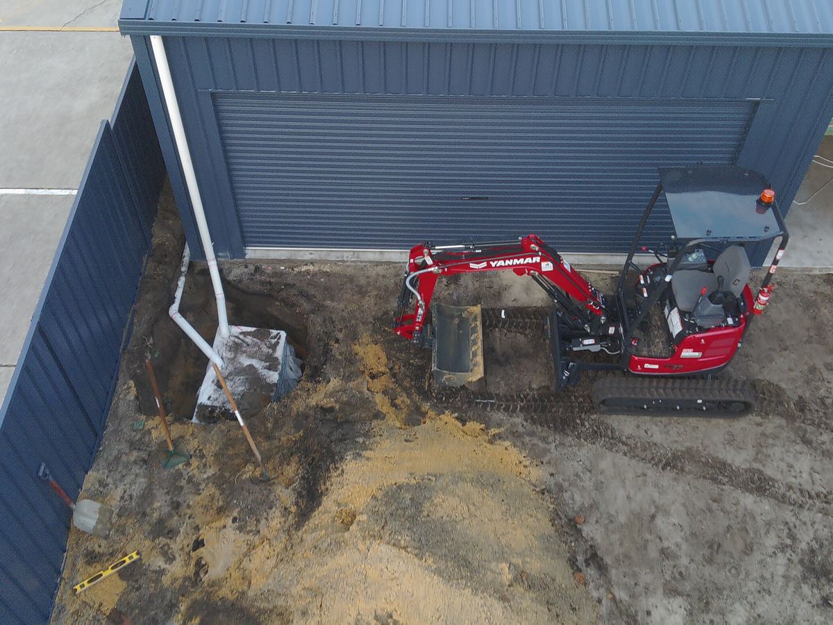 TNI Yanmar ViO17-1 mini excavator working on a soakwell installation with tight backyard access in Perth